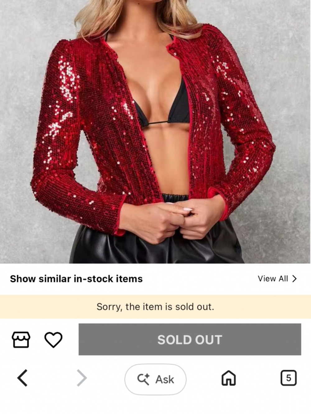 This appears to be a bright red, long-sleeve, sequin-embellished cropped top